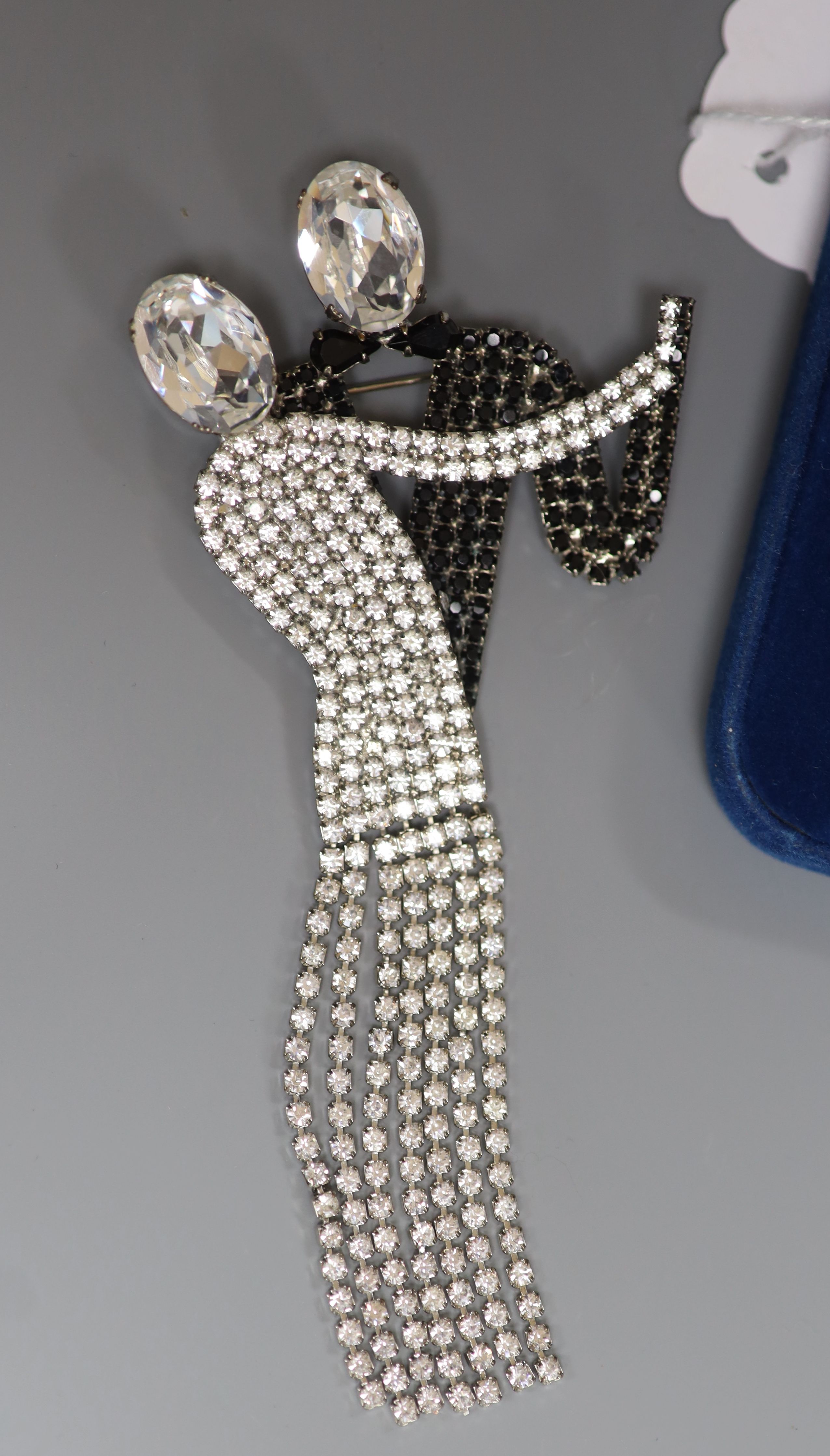 Four items of designer costume jewellery, including a Camrose & Kross 'Jacqueline Kennedy' reproduction flower brooch